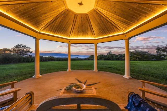 patio terrace at dusk with a lawn