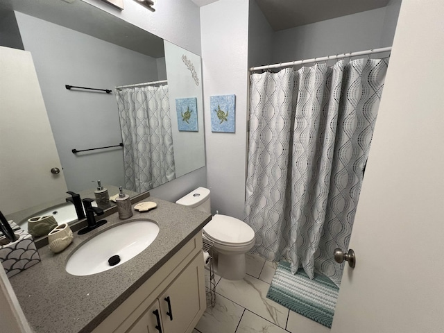 bathroom with curtained shower, vanity, and toilet