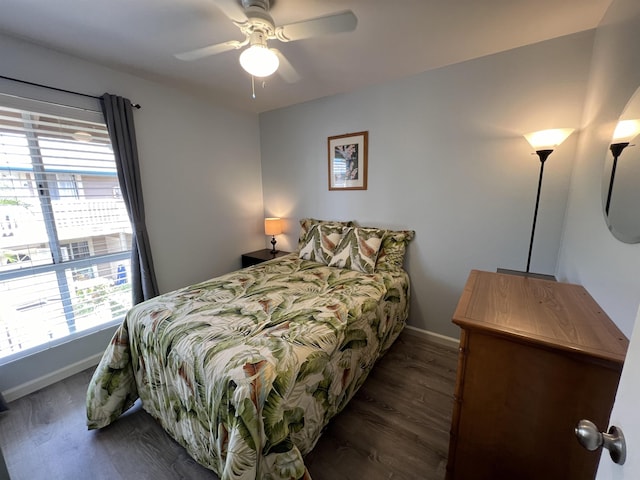 bedroom featuring dark hardwood / wood-style flooring and ceiling fan