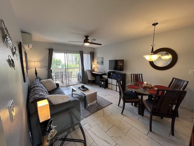 living room with ceiling fan and a wall unit AC