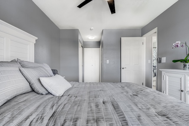 bedroom featuring ensuite bath and ceiling fan