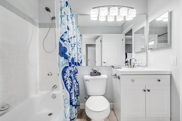 full bathroom featuring shower / tub combo with curtain, wood-type flooring, vanity, and toilet