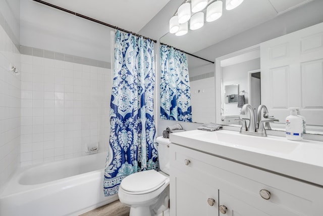 full bathroom featuring wood-type flooring, vanity, shower / bath combo with shower curtain, and toilet