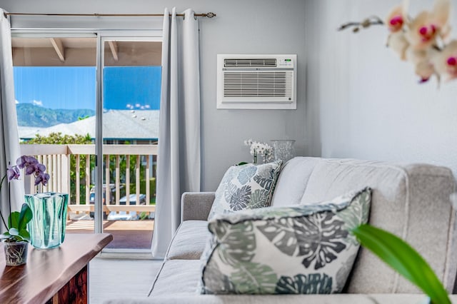 interior space with an AC wall unit and a mountain view