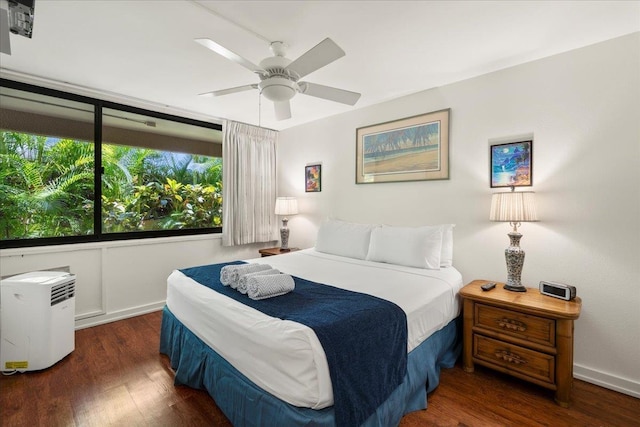 bedroom featuring wood finished floors and a ceiling fan