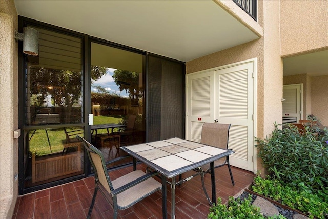 exterior space with outdoor dining area