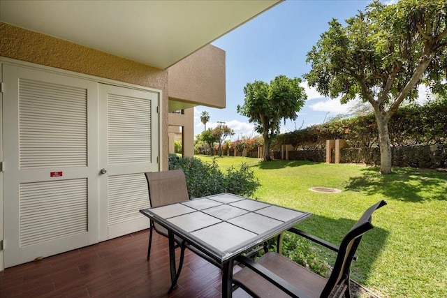 view of patio featuring outdoor dining area