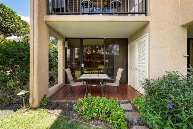 view of patio / terrace with outdoor dining area and a balcony