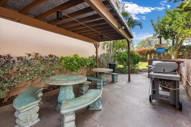 view of patio with a grill