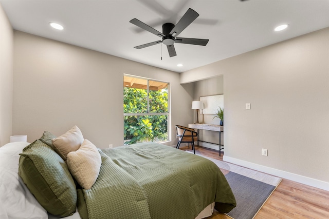 bedroom featuring ceiling fan and wood-type flooring