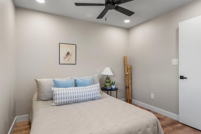 bedroom with ceiling fan and hardwood / wood-style floors