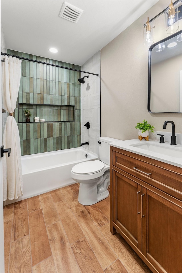 full bathroom with vanity, shower / bathtub combination with curtain, wood-type flooring, and toilet