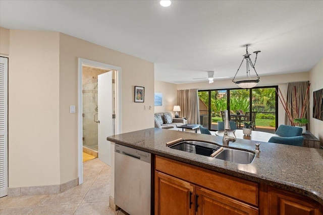 2777 S Kihei Rd Unit L-109, Kihei, HI 96753 - kitchen with dishwasher, open floor plan, dark stone counters, brown cabinets, and a ceiling fan