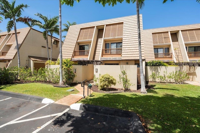 2777 S Kihei Rd Unit L-109, Kihei, HI 96753 - view of building exterior featuring uncovered parking
