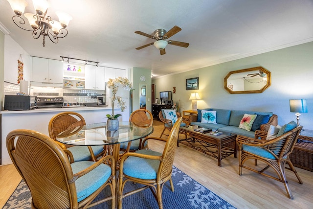 bedroom featuring ceiling fan, ornamental molding, and light hardwood / wood-style floors