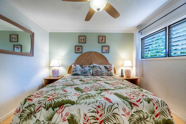 bedroom with ceiling fan, crown molding, and wood-type flooring