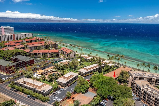 birds eye view of property featuring a water view and a view of the beach