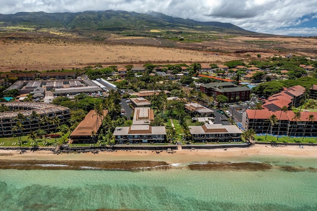 birds eye view of property featuring a water and mountain view