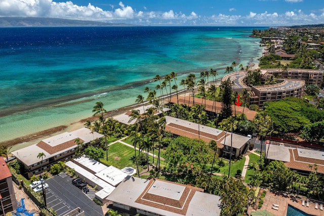 drone / aerial view with a water view and a beach view