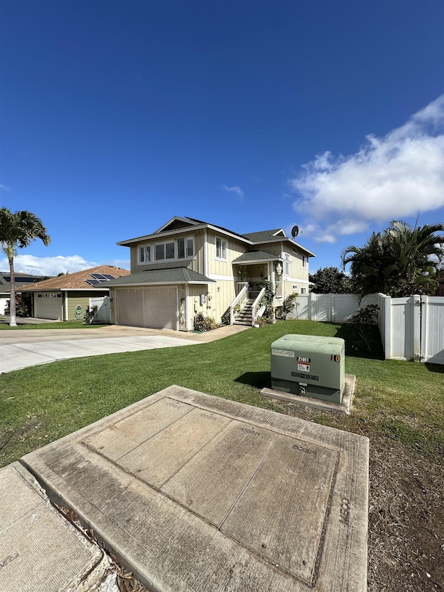 view of front of property featuring a front yard and a garage