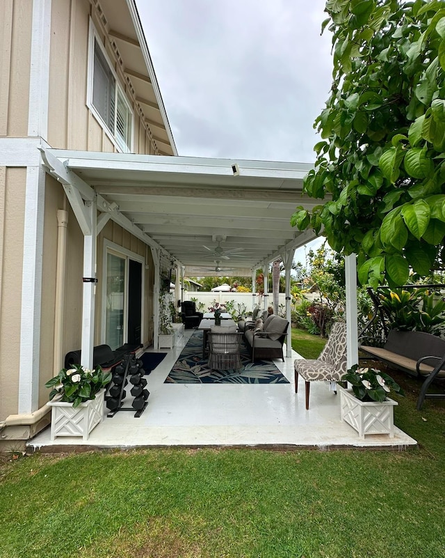 view of patio / terrace with ceiling fan and an outdoor living space