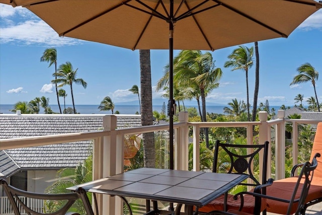 balcony featuring a water view