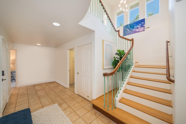 stairway featuring tile patterned flooring