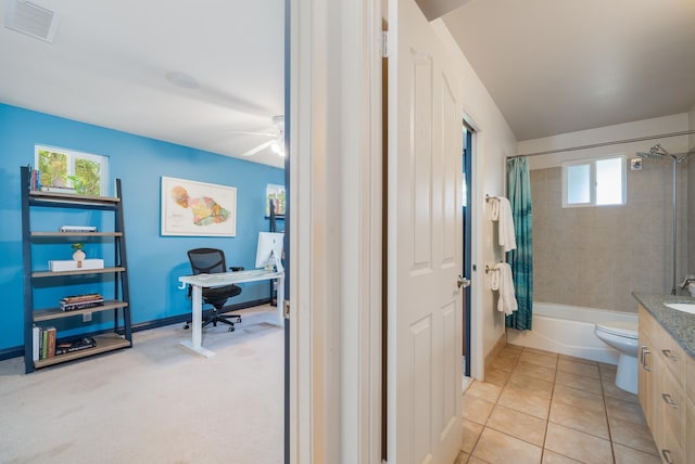 full bathroom with tile patterned flooring, vanity, ceiling fan, toilet, and shower / bath combo with shower curtain