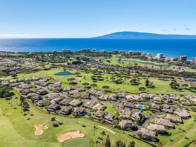 birds eye view of property with a water and mountain view