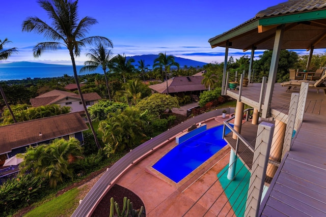 view of swimming pool with a mountain view