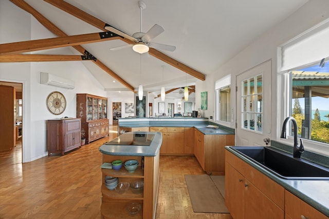 kitchen featuring lofted ceiling with beams, ceiling fan, light hardwood / wood-style floors, a kitchen island, and a wall unit AC