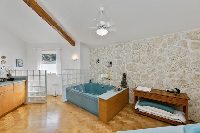 bathroom featuring ceiling fan, lofted ceiling with beams, parquet flooring, and a bath