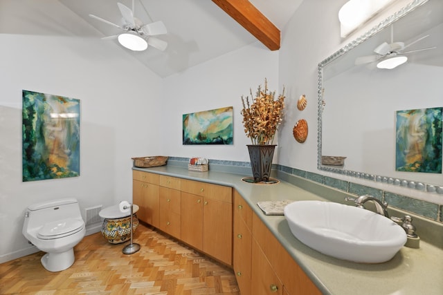 bathroom featuring parquet floors, ceiling fan, sink, vaulted ceiling with beams, and toilet