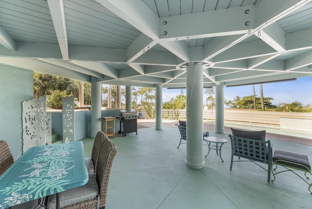 sunroom / solarium with beamed ceiling and wooden ceiling