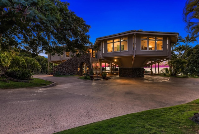 view of front of property featuring a carport