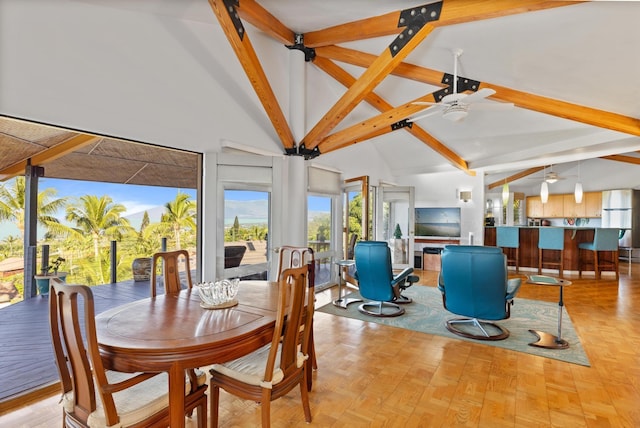 dining area with a wealth of natural light, beamed ceiling, high vaulted ceiling, and ceiling fan