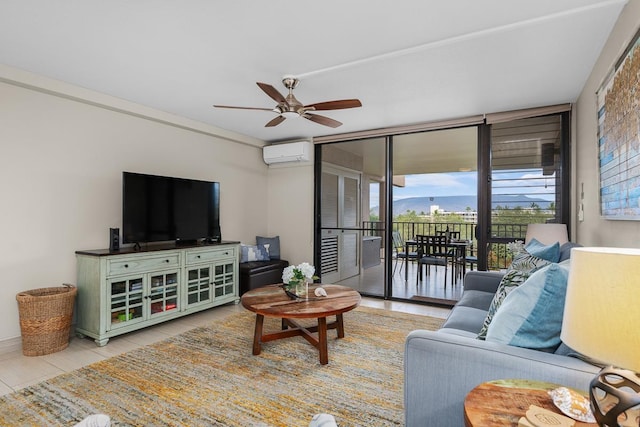 living room with ceiling fan, floor to ceiling windows, and a wall mounted air conditioner