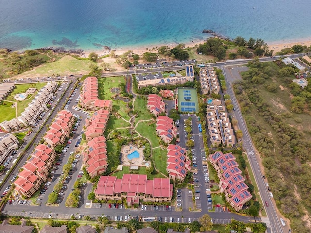 bird's eye view featuring a view of the beach and a water view