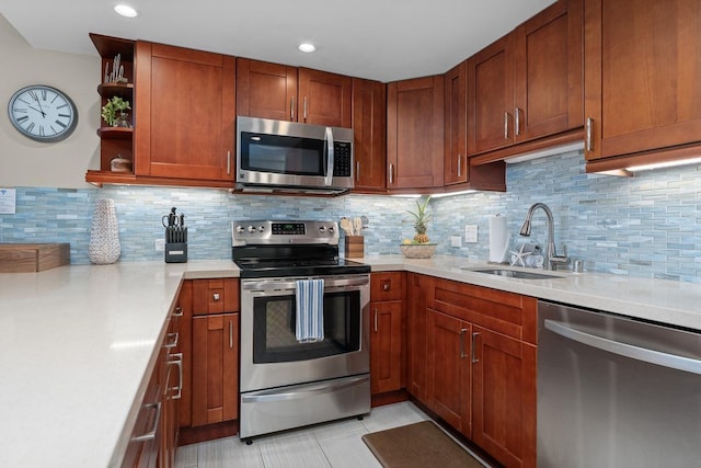 kitchen with stainless steel appliances, light tile patterned flooring, sink, and decorative backsplash