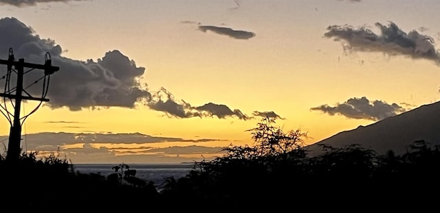 nature at dusk featuring a mountain view