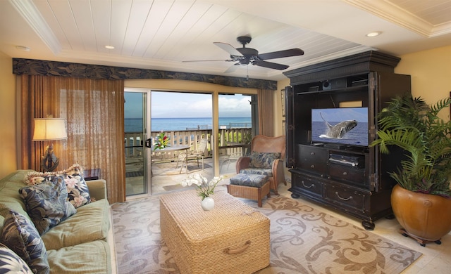 living room with crown molding, a tray ceiling, wooden ceiling, and ceiling fan