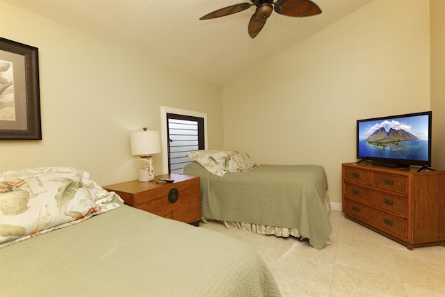 bedroom featuring light tile patterned floors, vaulted ceiling, and ceiling fan