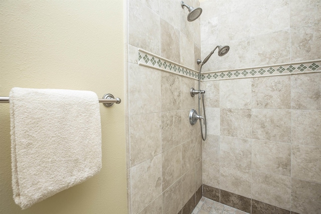 bathroom with a tile shower