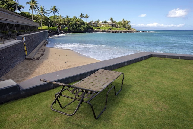 view of home's community featuring a yard and a water view