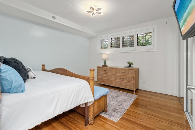 3788 Lower Honoapiilani Rd Unit C102, Lahaina, HI 96761 - bedroom with wood finished floors and baseboards