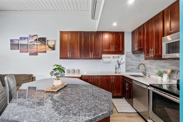 3788 Lower Honoapiilani Rd Unit C102, Lahaina, HI 96761 - kitchen with appliances with stainless steel finishes, a sink, recessed lighting, tasteful backsplash, and light wood-style floors