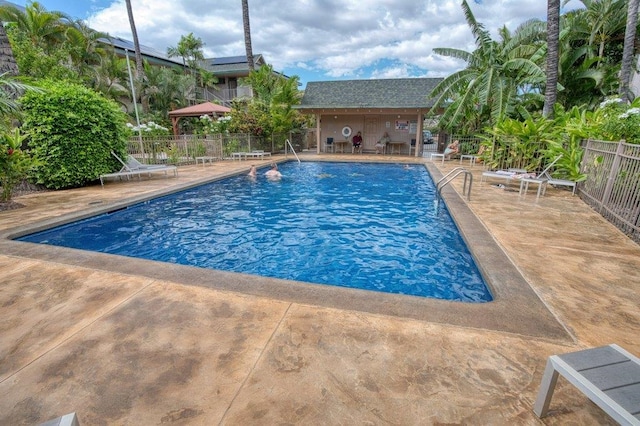 view of swimming pool with a patio area