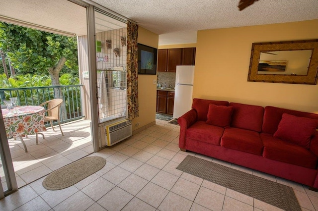 tiled living room with a textured ceiling and sink