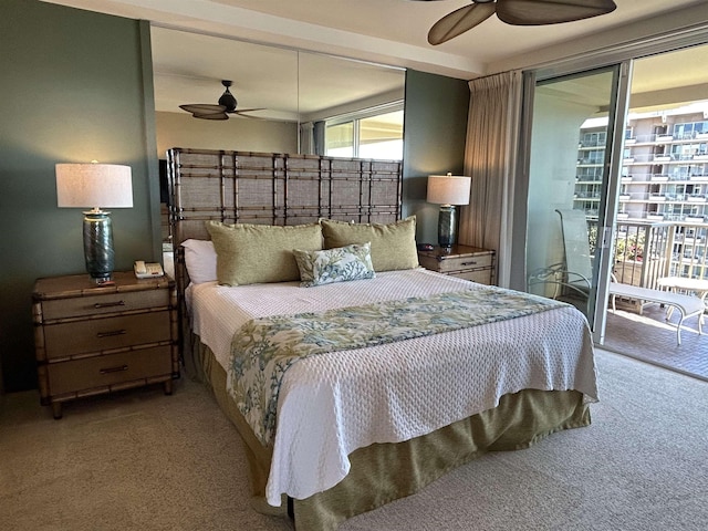 bedroom featuring access to exterior, carpet flooring, and a ceiling fan
