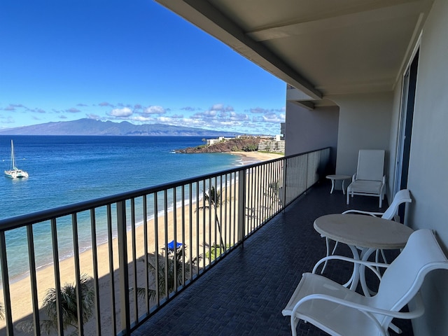 balcony with a water and mountain view